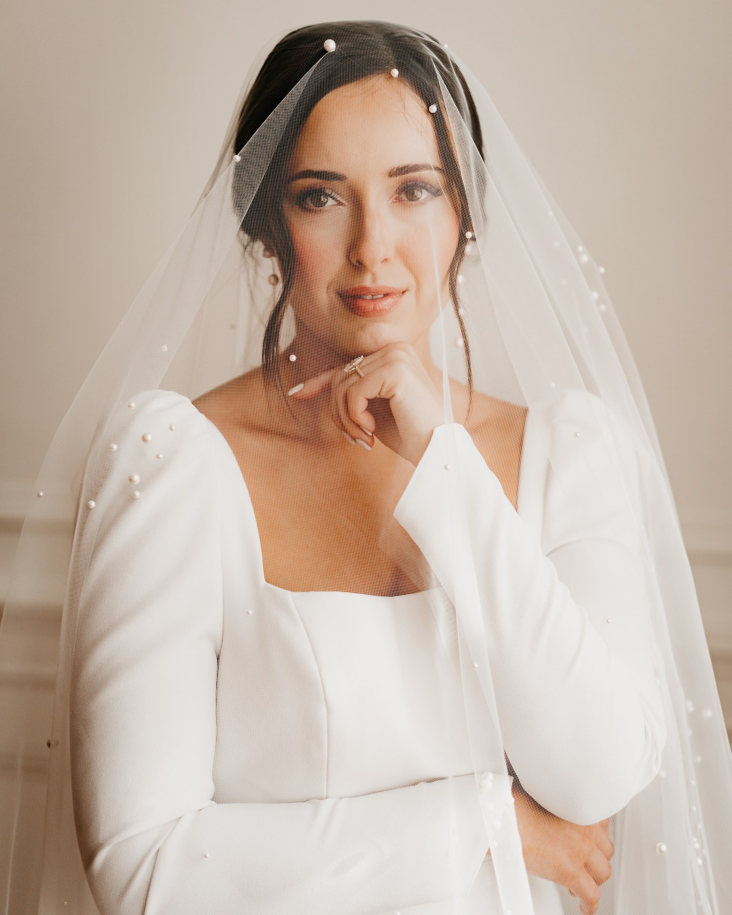 Bridal portrait with pearl veil